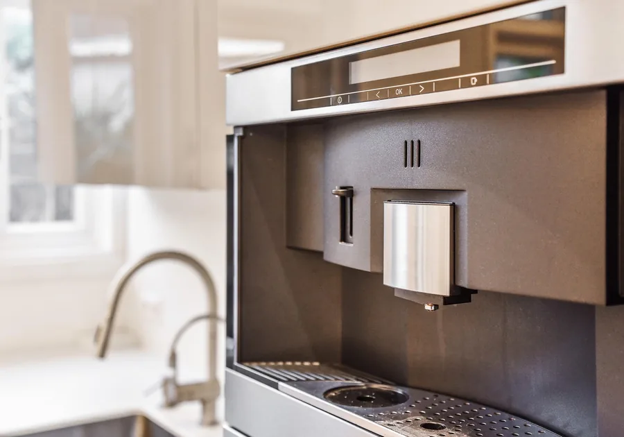 Built-in coffee machine in a fitted kitchen cabinet